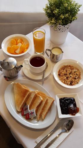 a breakfast table with toast and coffee and orange juice at Abcot Inn in Sylvania
