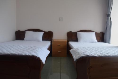 Een bed of bedden in een kamer bij Binh Minh Hotel