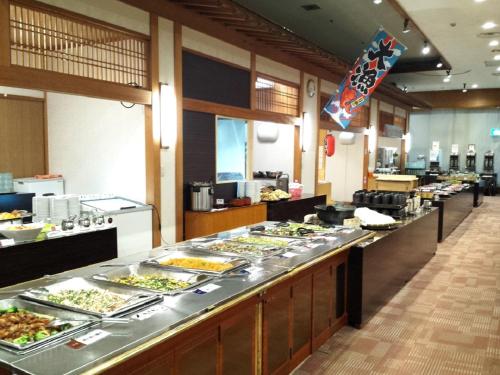 a buffet line with many plates of food at Nangoku Hotel in Minamiboso
