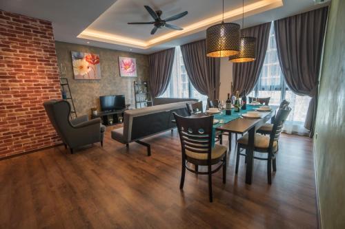 a dining room with a table and chairs at Perfect Getaway @Vivacity in Kuching