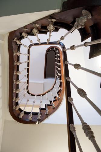 a mirror hanging on a wall at Maison Souply in Châlons-en-Champagne