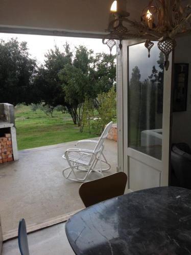 a view of a patio with a table and chairs at Kleinkloof Farm in Piketberg