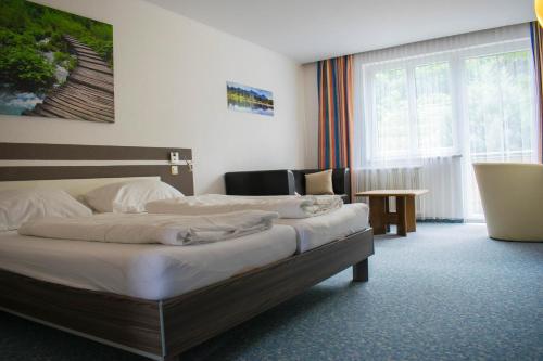 Postel nebo postele na pokoji v ubytování Gasthof zur Wachau