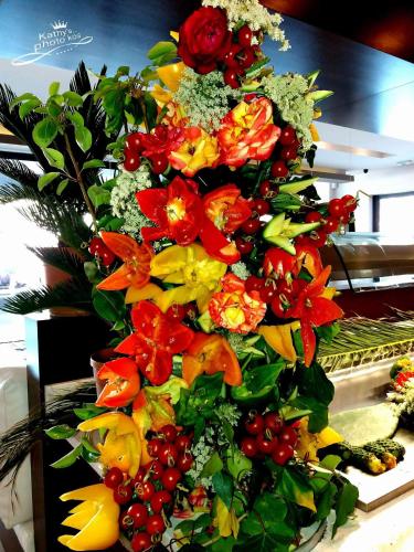 a bouquet of flowers on top of a counter at Cosmopolitan Hotel in Kos Town