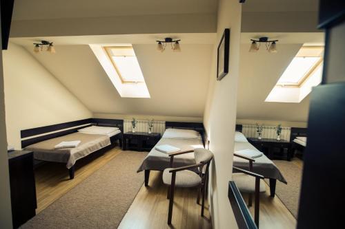 Postel nebo postele na pokoji v ubytování Premiere Hotel