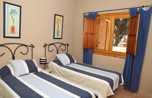 Кровать или кровати в номере Vivienda Vacacional Los Balconcitos