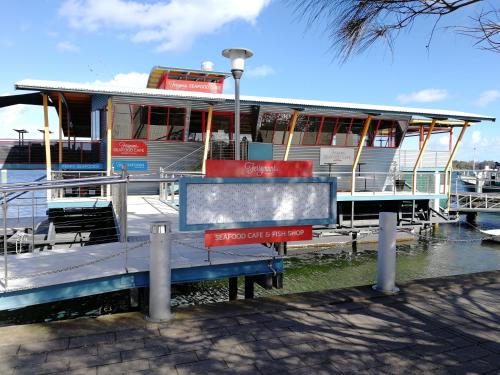 a boat is docked at a marina at Banjo Paterson Motor Inn in Lakes Entrance