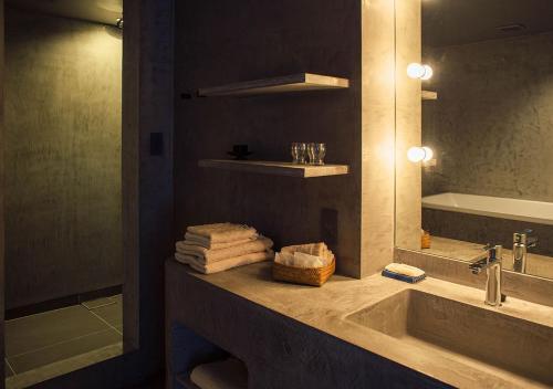 a bathroom with a sink and a mirror at Malda Kyoto in Kyoto