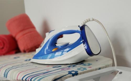a blue and white telephone sitting on top of a table at ArbarHome in Klang