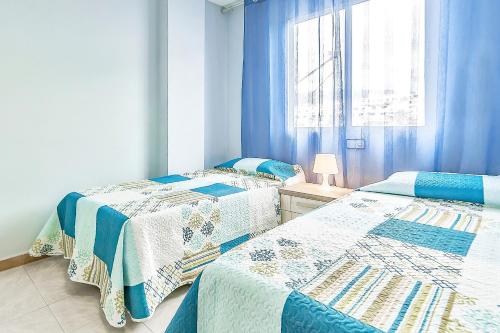 Ένα ή περισσότερα κρεβάτια σε δωμάτιο στο Jardines Canarios