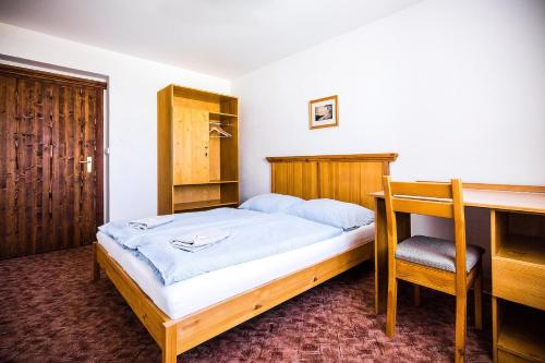 Postel nebo postele na pokoji v ubytování Chata Jiriho na Seraku