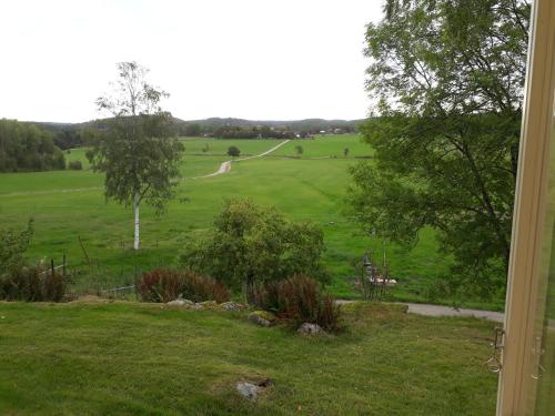 a view from a window of a golf course at Älgbergets Bed & Breakfast in Ucklum