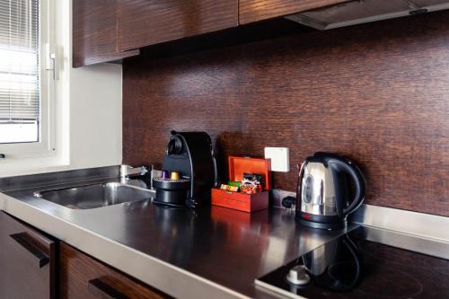 a kitchen with a sink and a counter top at Sea view apartment suite in Tel Aviv