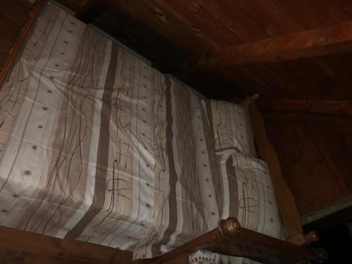a close up of a bed in a room at Splav "Slap" - Bungalovi in Danilovgrad