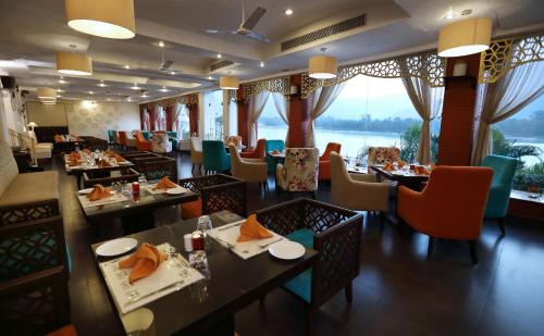 A restaurant or other place to eat at GANGA KINARE- A Riverside Boutique Resort, Rishikesh