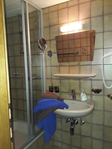 a bathroom with a sink with a blue towel at Haus Morgensonne in Pettneu am Arlberg
