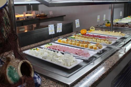 a buffet line with many different types of food at Playadulce in Aguadulce