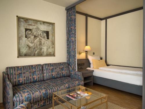 Postel nebo postele na pokoji v ubytování Posthaus Hotel Residenz