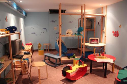 a room filled with lots of different types of furniture at Best Western Hotel Jena in Jena
