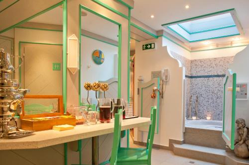 a bathroom with a table with a mirror and a shower at Hotel-Garni Jakober in Tux