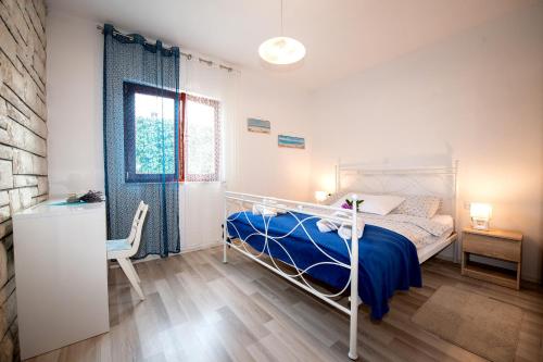 Łóżko lub łóżka w pokoju w obiekcie Apartment Mediteraneo