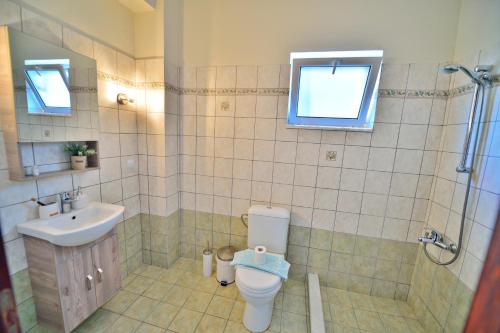a bathroom with a toilet and a sink at Kissamos View Apartment in Kissamos