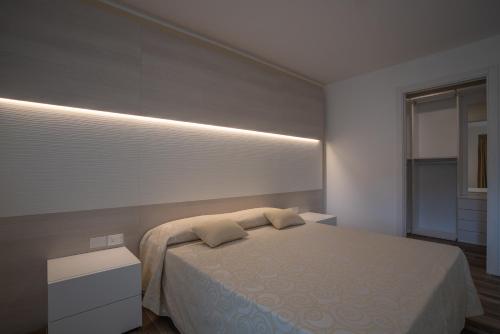 Ένα ή περισσότερα κρεβάτια σε δωμάτιο στο Aparthotel Miramare