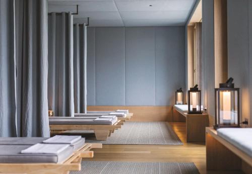 a room with a row of mattresses on display at Hotel Almhof Schneider in Lech am Arlberg