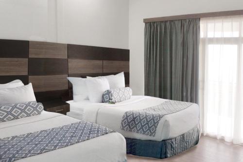 Postel nebo postele na pokoji v ubytování Horizonte Resort, Hotel & Spa