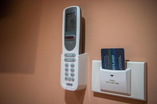 a nintendo wii remote and a book in a box at Let's Zzz Bangkok in Bangkok