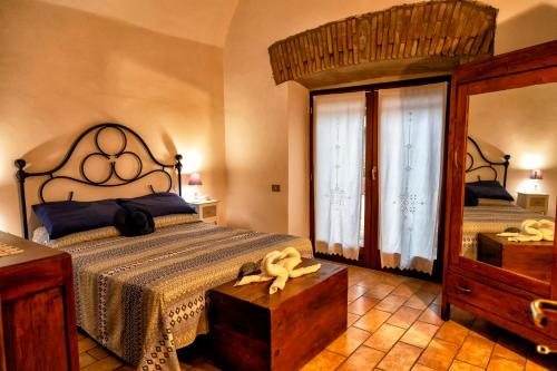 מיטה או מיטות בחדר ב-Il Castelletto del Salamaro
