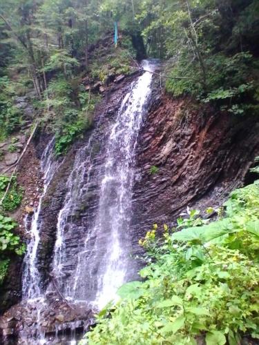 a waterfall on the side of a mountain at Marichka in Yablunytsya