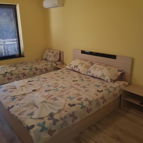 Ένα ή περισσότερα κρεβάτια σε δωμάτιο στο Guest House Ileana