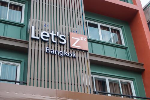 a sign on the side of a building at Let's Zzz Bangkok in Bangkok