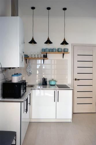 Η κουζίνα ή μικρή κουζίνα στο Romantic Apartment on Rynok square with Air-Conditioning