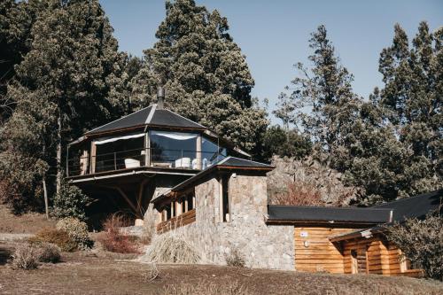 a glass house on top of a building at Arrayan Lake View Mountain Lodge & Casa De Te Arrayan in San Martín de los Andes