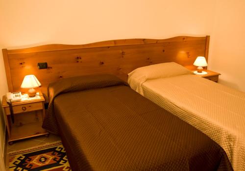 Un pat sau paturi într-o cameră la Belvedere San Nicola