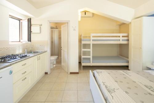 a kitchen with a sink and a bunk bed at Country House Villa Sabrina in San Ginesio