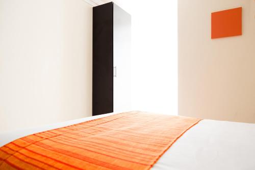 Una cama o camas en una habitación de Inn Express Hotel Tula
