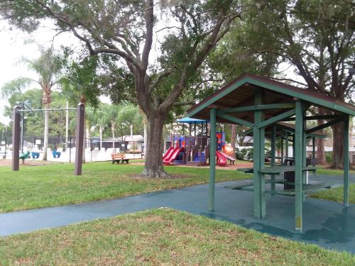 a park with a bench and a playground at 2 Bedroom , 2 Bath , Villa in Oldsmar