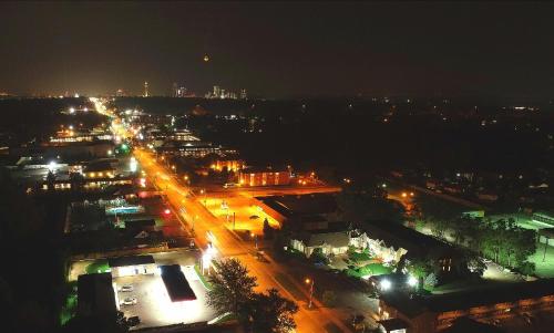 a city lit up at night with street lights at Fullerton Manor Inn in Niagara Falls