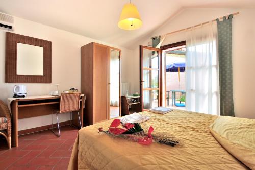 Postel nebo postele na pokoji v ubytování Agriturismo Podere San Michele