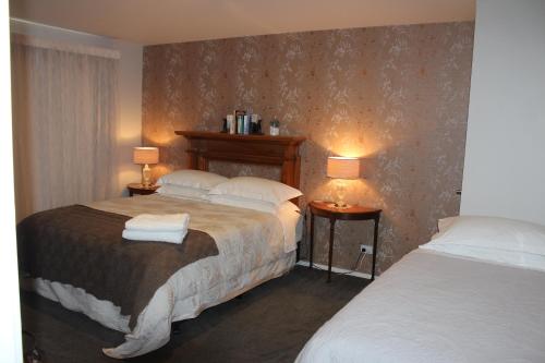 מיטה או מיטות בחדר ב-The Mackenzie Suites