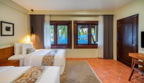 Postel nebo postele na pokoji v ubytování Sundancer Residences and Villas Lombok