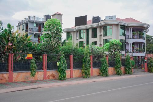 a row of houses on the side of a street at Green Mountain Hotel in Arusha