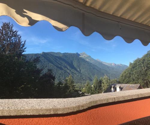 a view of the mountains through a window at B&B Al Sasso in Toceno