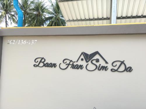 a window sill with a sign for a house at Baan Fran Sim Da in Bang Tao Beach