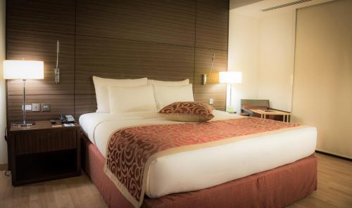 Кровать или кровати в номере Asdal Gulf Inn Boutique Hotel- SEEF