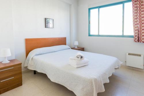 Ένα ή περισσότερα κρεβάτια σε δωμάτιο στο Apartamentos Fernando de los Rios