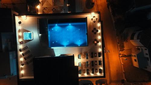 a flat screen tv on a wall with lights at Hotel Scala d'Oro in Vodice